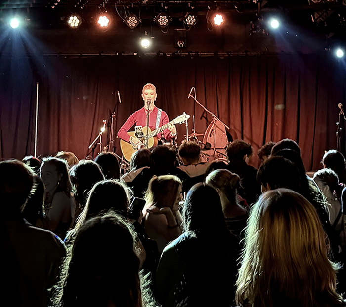 Zara performing on stage at the Old Fire Station music venue.
