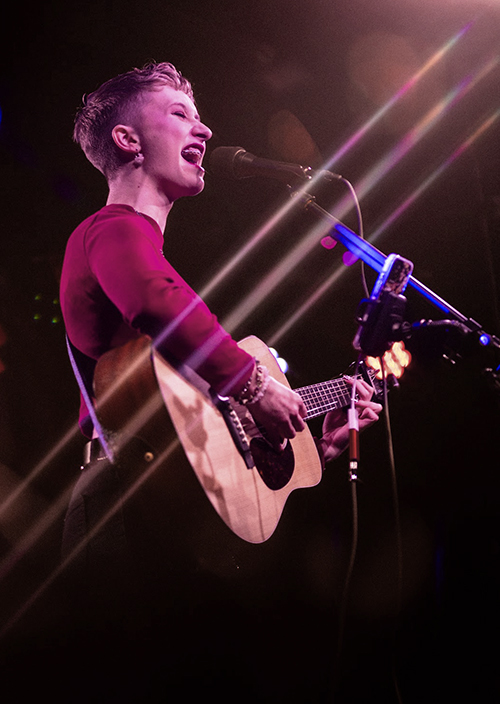 Zara performing on stage at the Old Fire Station music venue.